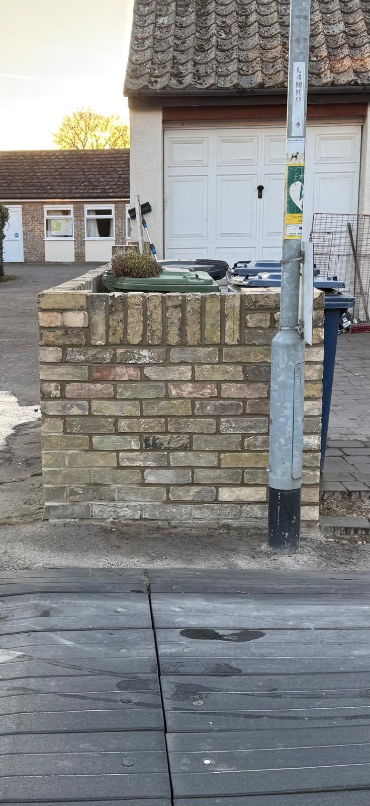 Brick wall bin enclosure