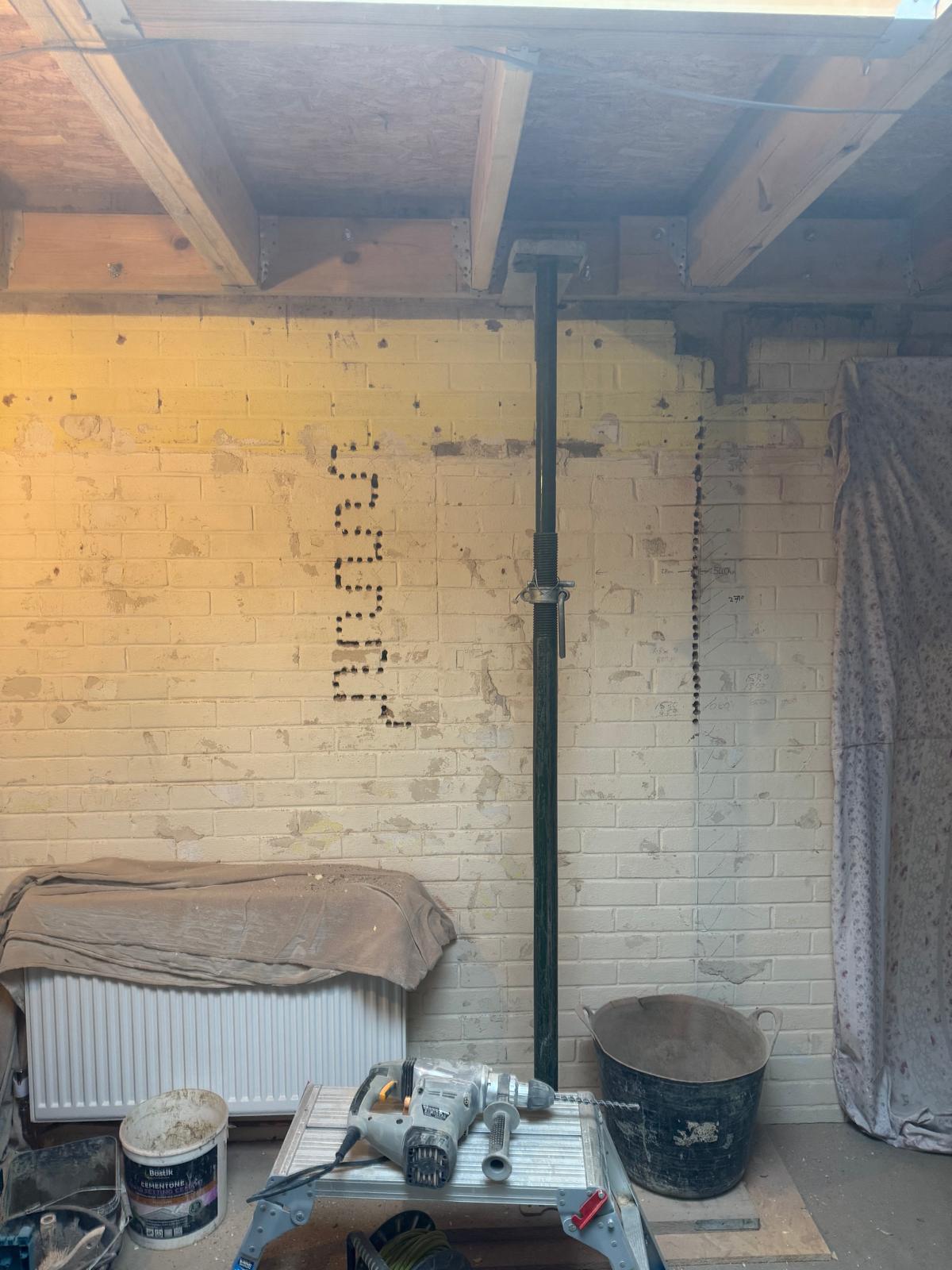 Steel beam installation in garage conversion