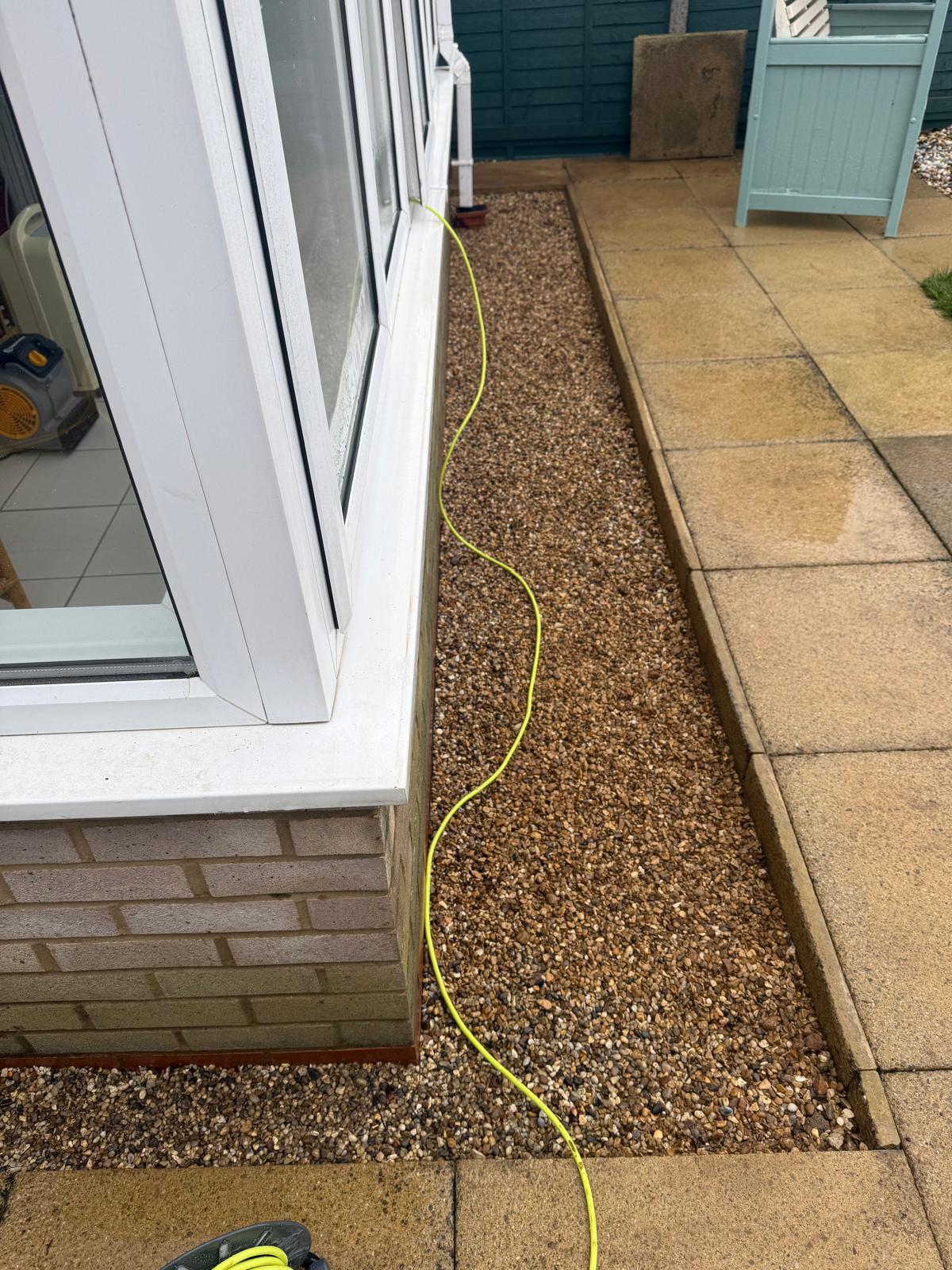 Conservatory patio with gravel border detail