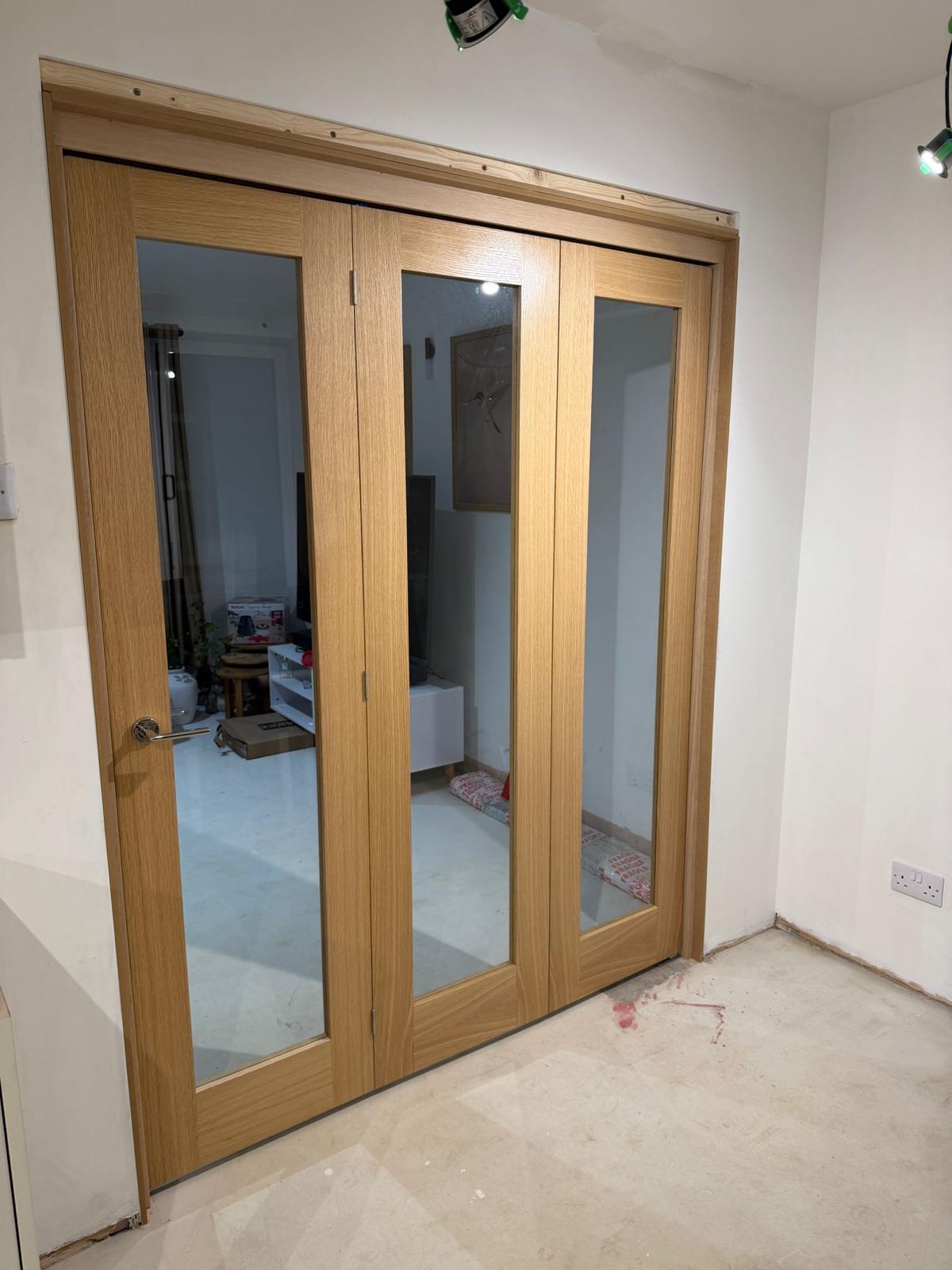Oak glazed bifold doors — kitchen extension result